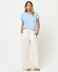 LSPACE All Day top in sky blue, front view on model.
