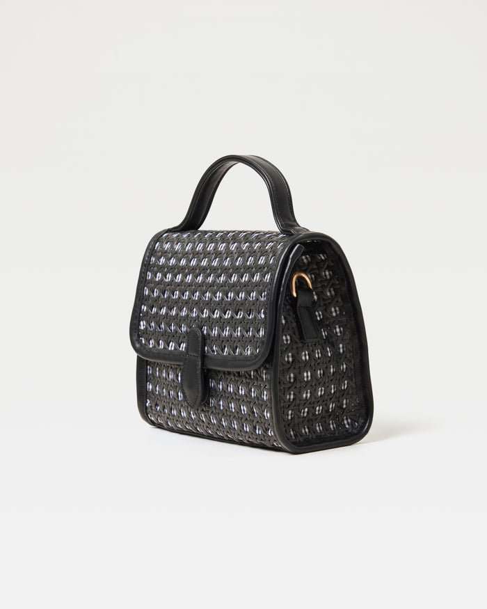 Angled view of the Amelia Bag in black showing the structured silhouette and woven detail.