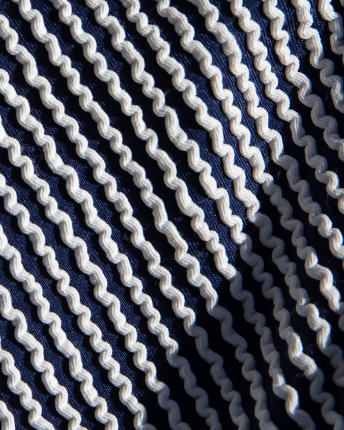 Close-up of navy and white stripe textured fabric used in the LSPACE midnight blue.