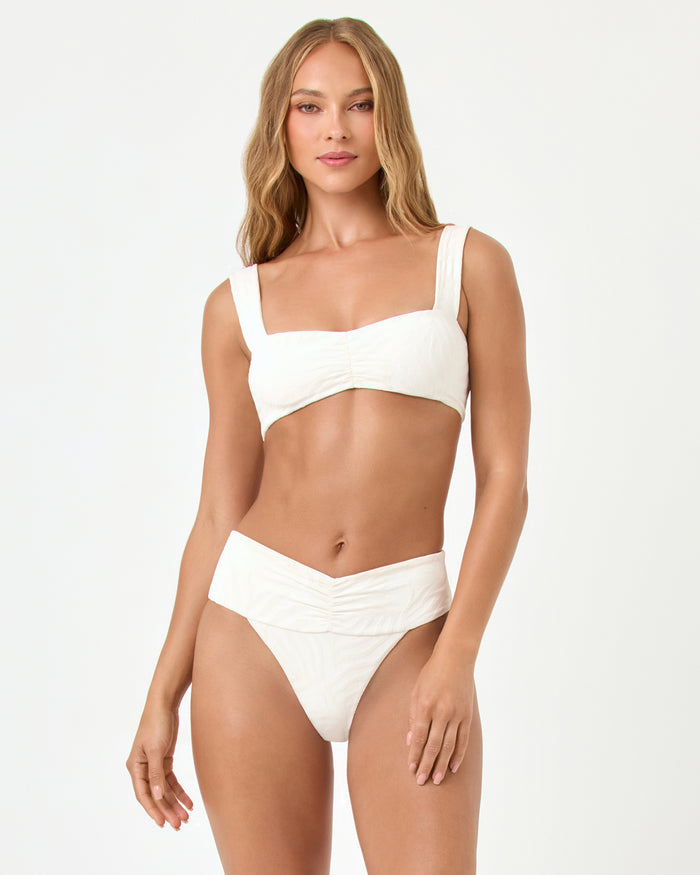 Front view of a model wearing the LSPACE cream Marlee Bikini Top, paired with the Bardot Bikini Bottom.