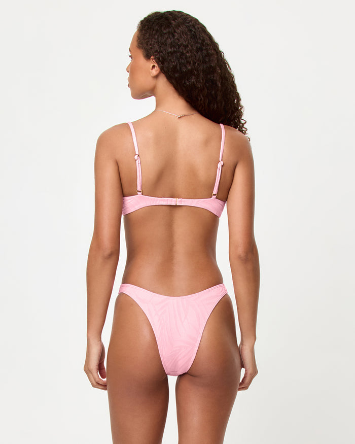 LSPACE Belle bikini top and Donnie bikini bottom in Pink Sugar, back view on model.
