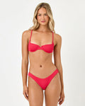 Front view of a model wearing the LSPACE Pucker Up Pout Belle Bikini Top with a textured underwire balconette silhouette and straight neckline.