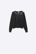 black soft knit sweater embellished with sequins on the front