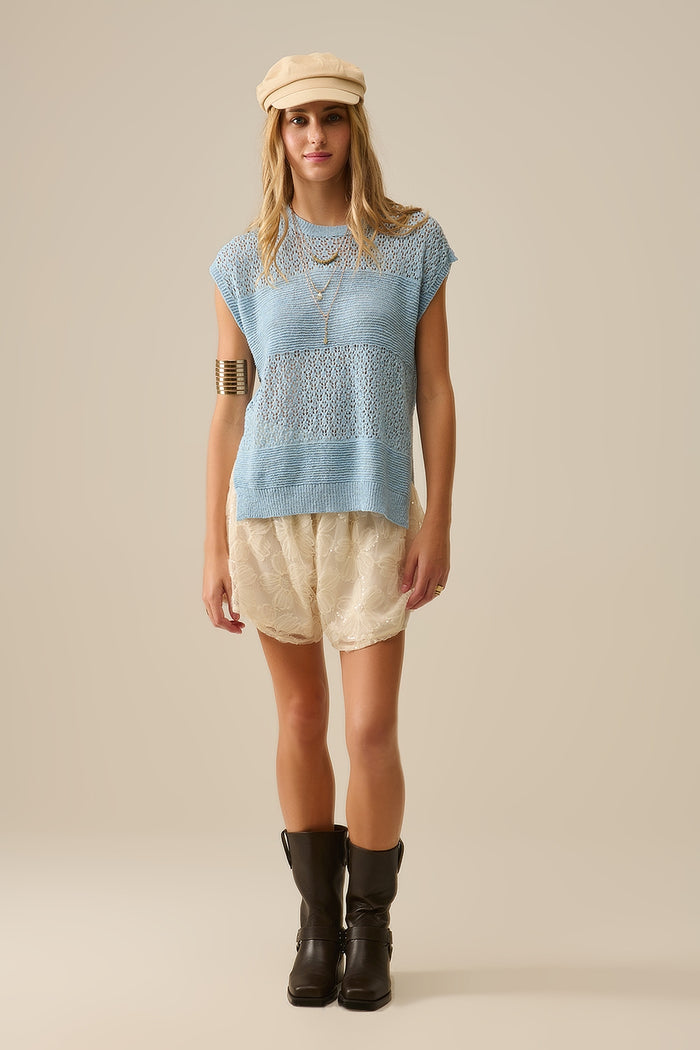 Blue sweater with soft open knit and dropped sleeves