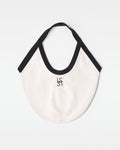 Off-model back view of the black and cream Bronte Canvas Bag showing a L*SPACE logo.