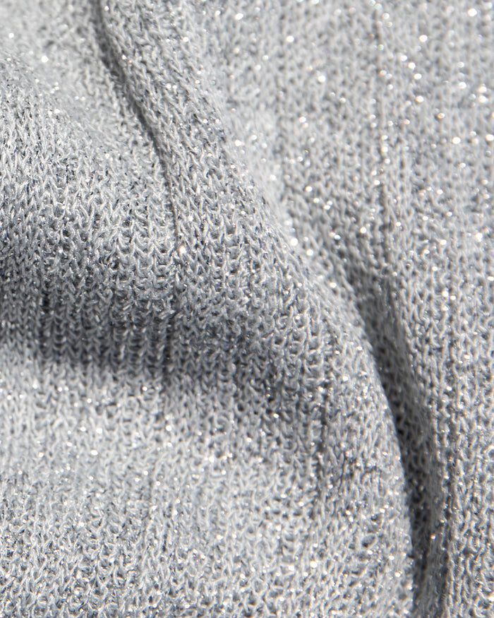 Close-up of the LSPACE Callie Halter in metallic silver, showcasing the ribbed knit fabric with silver metallic lurex thread throughout.