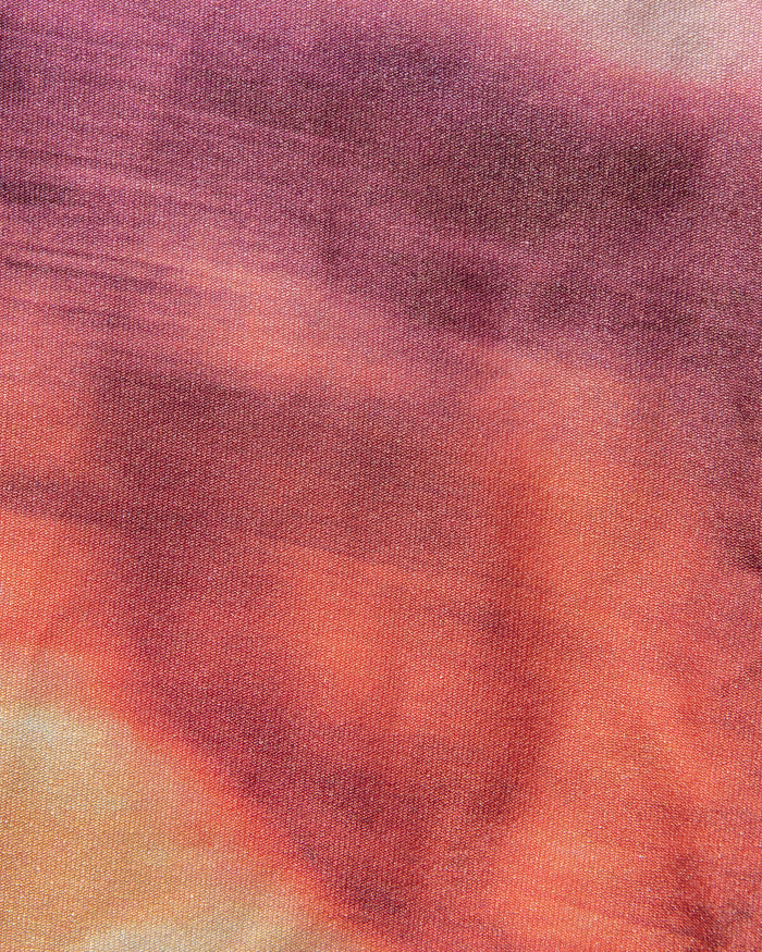 Close-up of Island Hopper tropical sunset print fabric in pink, purple, and peach tones used in the LSPACE Island Hopper.