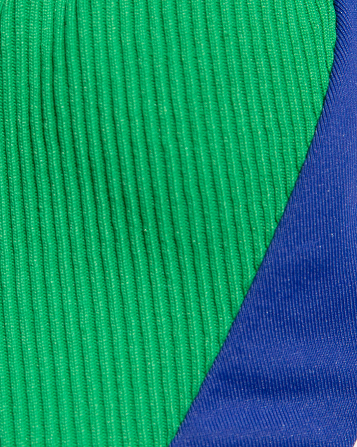 Close-up of green and cobalt blue ribbed fabric.