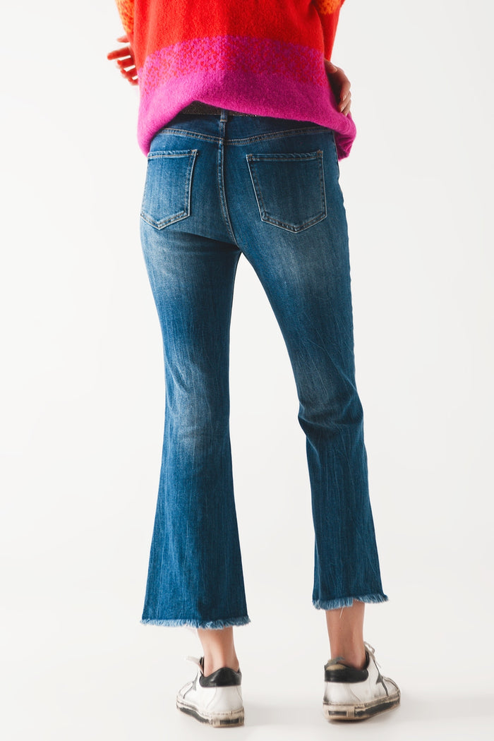 Flared jeans with raw edge in mid wash - Denim