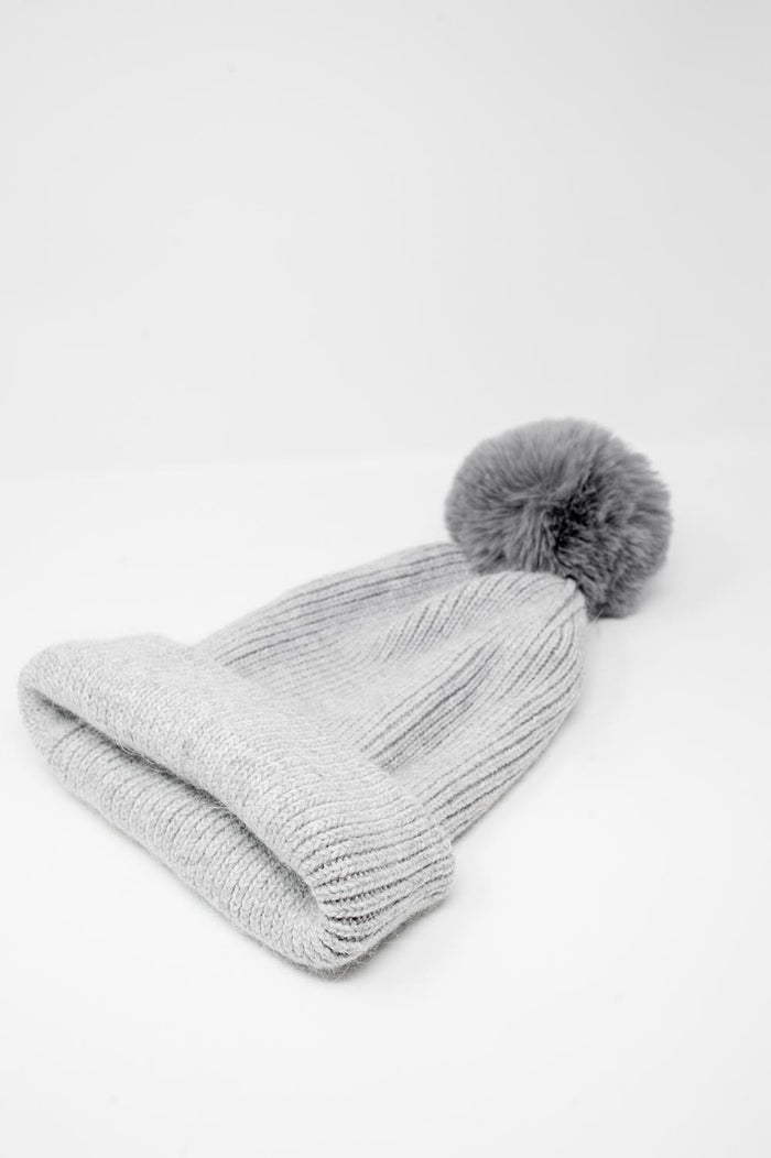 Gray knitted hat with pompom