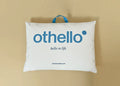 Cloudia filled pillow with othello logo, stitched edges, white cover