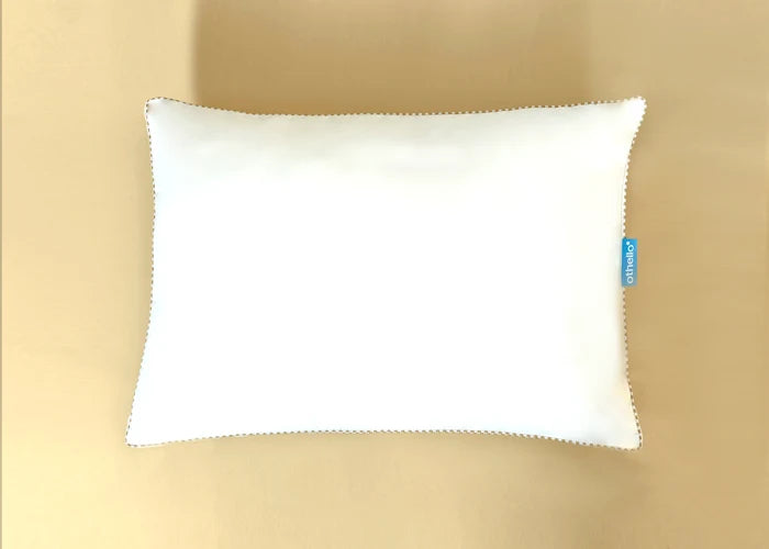 Cloudia filled pillow, white with stitched edge and blue othello tag