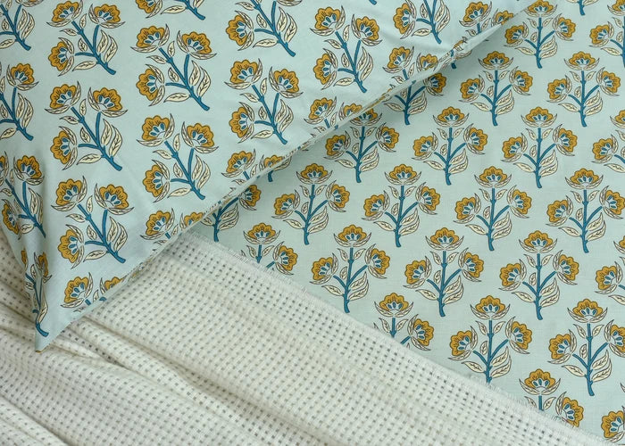 Cotton bed sheet with blue and yellow floral tree pattern