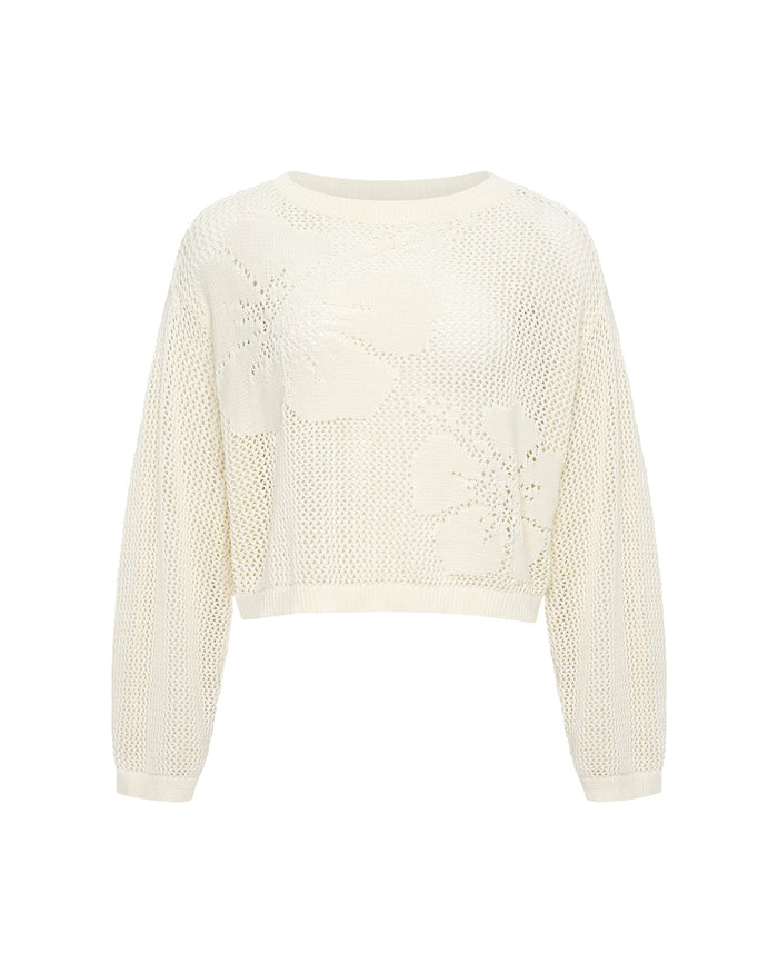 Off-model view of the LSPACE Island Time Sweater in Cream, a cropped open-knit crochet pullover with a floral motif and long sleeves.