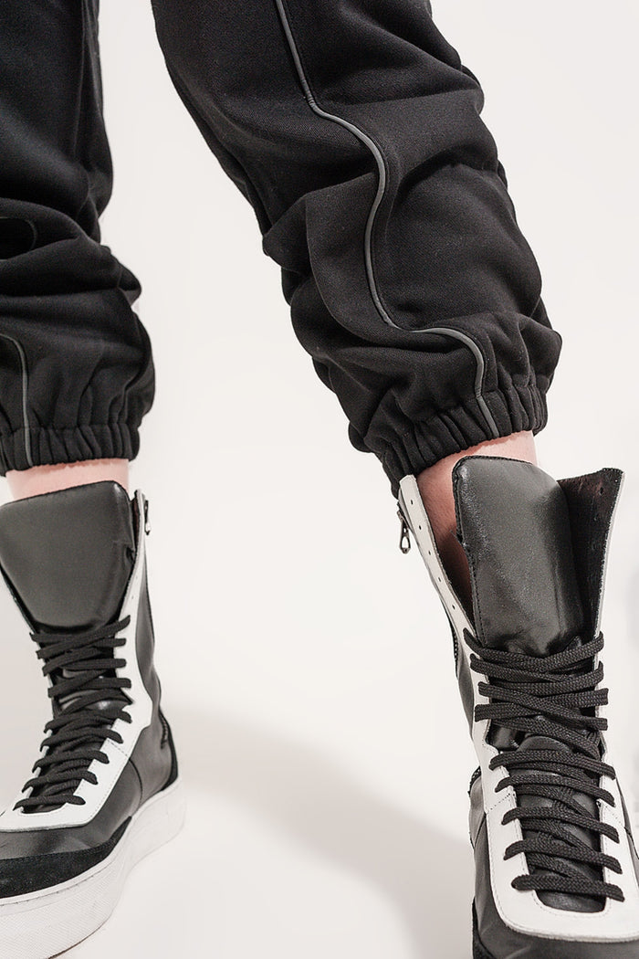 Joggers with drawstring waist and front seam in black - trousers