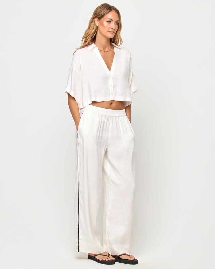 LSPACE Kitt top in Cream, three-quarter view on model.