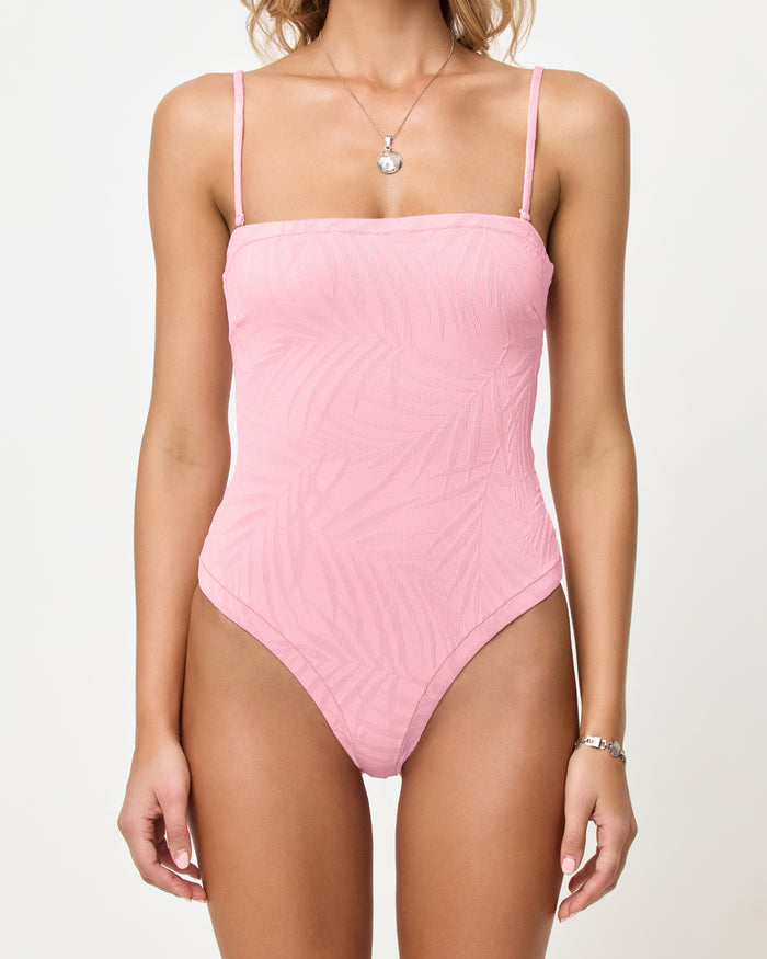 LSPACE La Femme one piece swimsuit in Pink Sugar, close-up detail view on model with straps.
