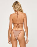 Back view of a model wearing the LSPACE brown sugar Levy Bikini Bottom with a textured brown and white stripe pattern, showing side tie detail and cheeky coverage, paired with a matching triangle bikini top.
