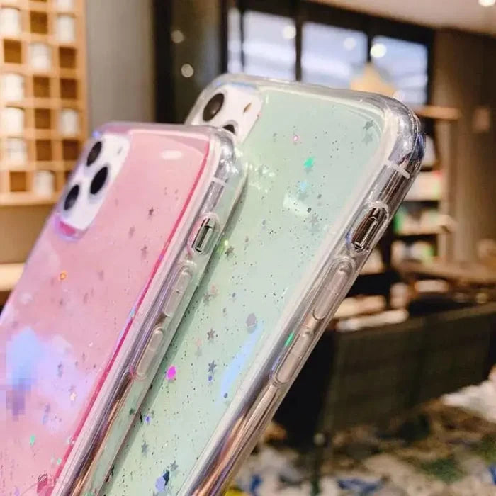 there are three iphones that are sitting on a table