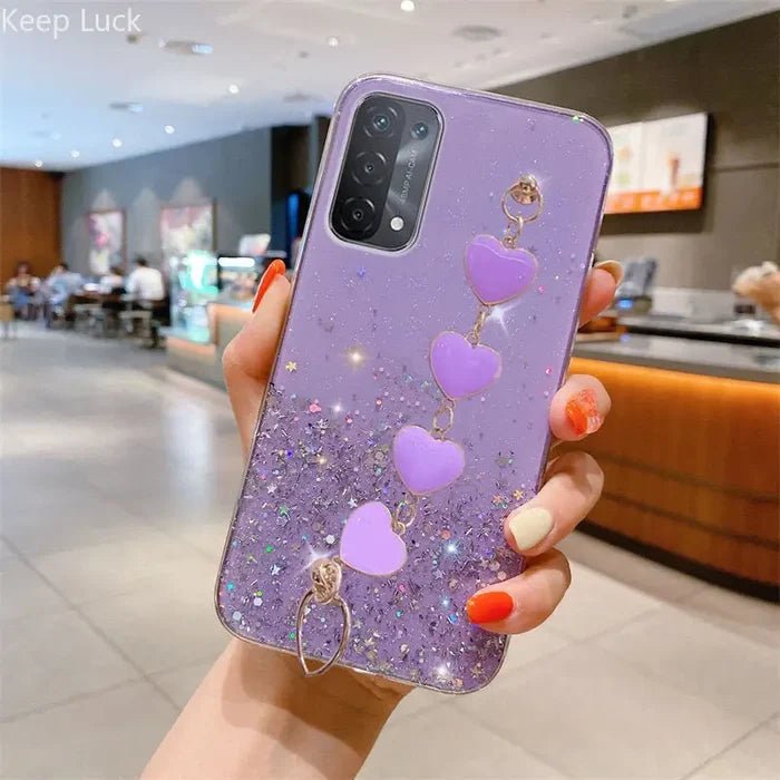 a woman holding a purple phone case with heart shaped balloons