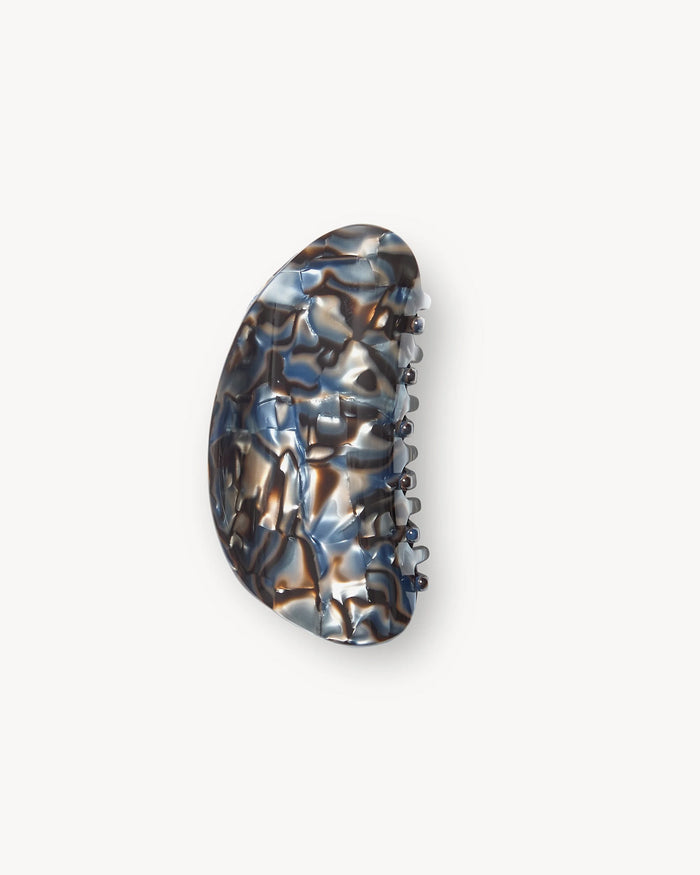 View from above showing the Machete Crescent Claw Clip in blue horn showing the shiny finish