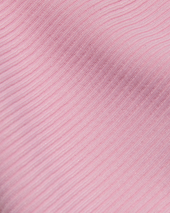 Close-up detail of the LSPACE pink sugar cream ribbed swimwear fabric showing the fine rib texture and soft pink color.