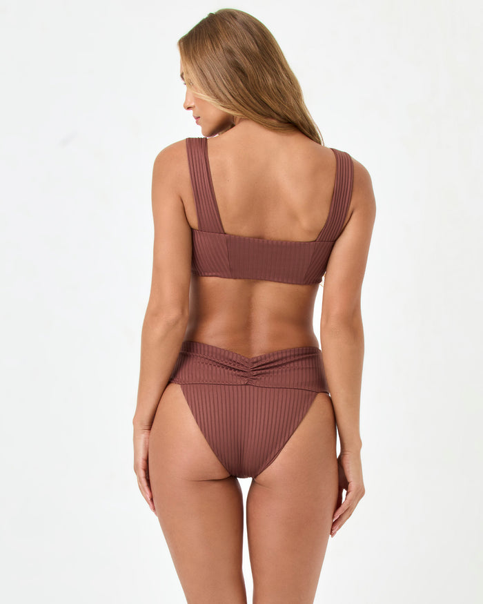Back view of a model wearing the LSPACE cafe Marlee Bikini Top with matching cafe Bardot Bikini Bottom.