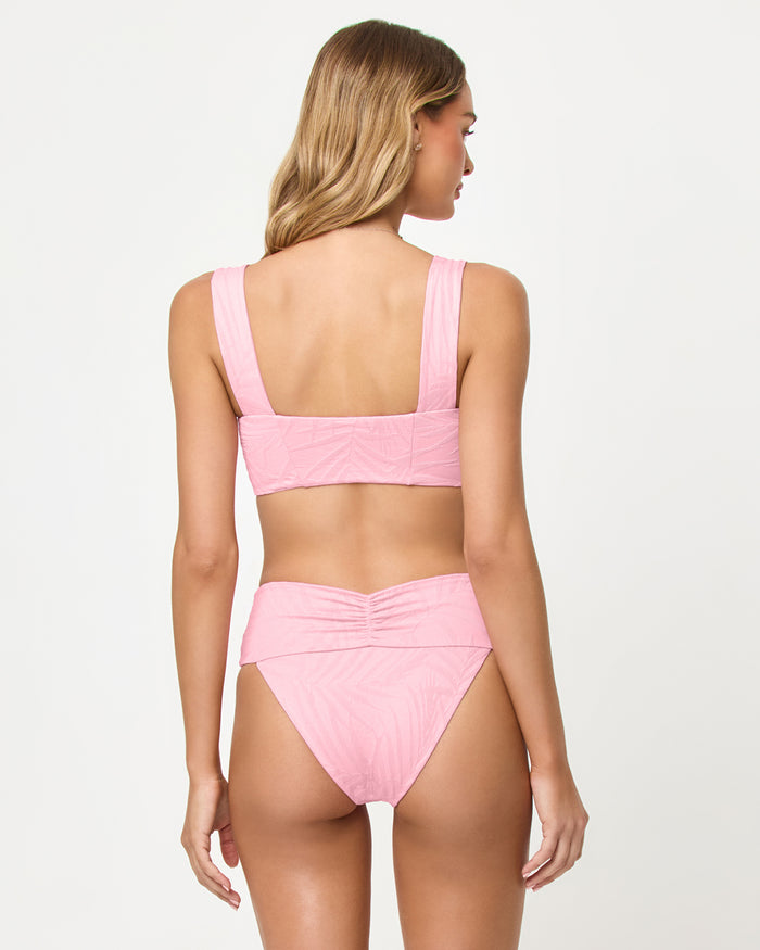 LSPACE Marlee bikini top in Pink Sugar, back view on model.