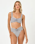 Front view of a model wearing the LSPACE sail along stripe Marlee Bikini Top with ruched front detail, paired with the Bardot Bikini Bottom.