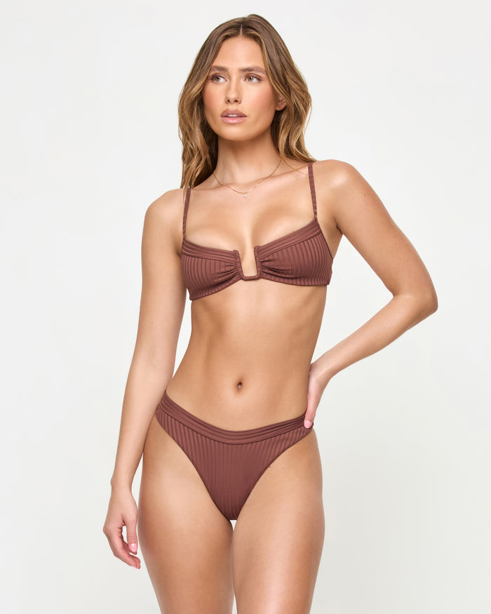 Front view of a model wearing the LSPACE cafe Peyton Bikini Top with a matching cafe Mercer Bikini Bottom.