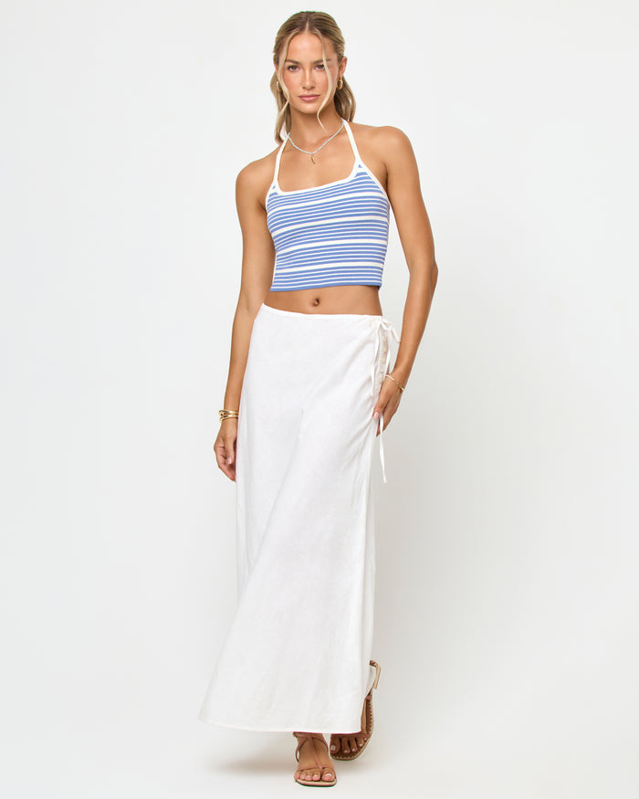 Front view of a model wearing the LSPACE Positano Top in outer banks stripe, a cropped halter top with a square neckline and blue and cream horizontal stripes.
