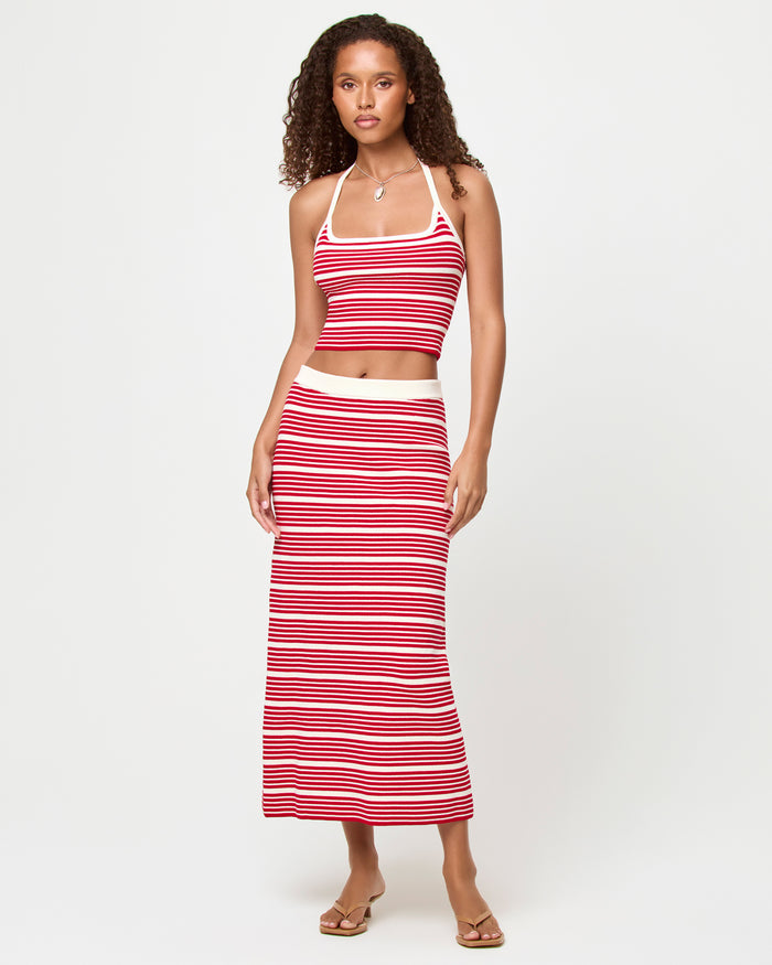 Front view of a model wearing the LSPACE Positano Top and Ravello Skirt in superbloom stripe, a ribbed fitted fabric with red and cream horizontal stripes.