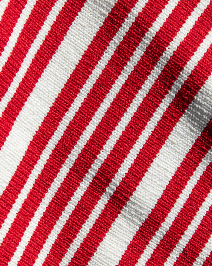 Close-up of the LSPACE Positano Top and Ravello Skirt in superbloom stripe, highlighting the ribbed red and cream horizontal stripe fabric texture.