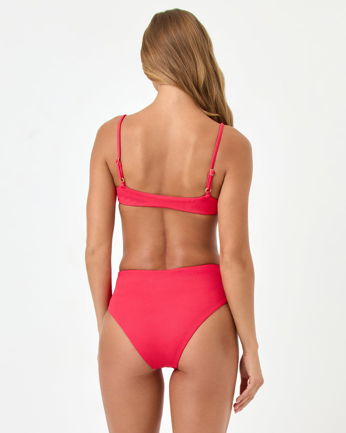 Back view of a model wearing the LSPACE Pout Presley Bikini Top with adjustable straps and gold ring hardware, styled with the matching Soleil Bikini Bottom.