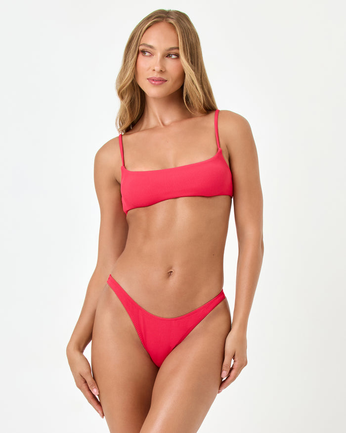 Front view of a model wearing the LSPACE Pout Presley Bikini Top with a square neckline and thin adjustable straps, styled with the Donnie Bikini Bottom.