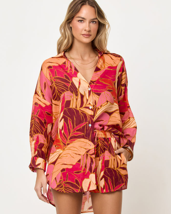 Close-up front view of model wearing the LSPACE Rio Tunic in leaf it to me showing the leaf print and fabric detail.