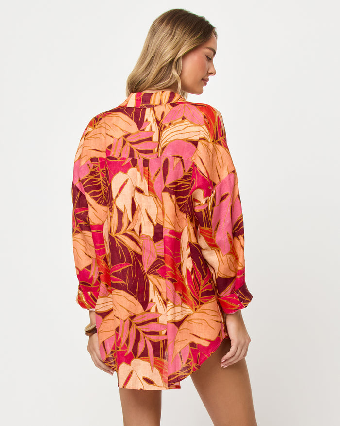 Back view of model wearing the LSPACE Rio Tunic in leaf it to me, a leaf-print tunic coverup.