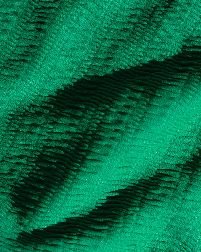 Close-up of isle green crinkle textured fabric used in the LSPACE isle.
