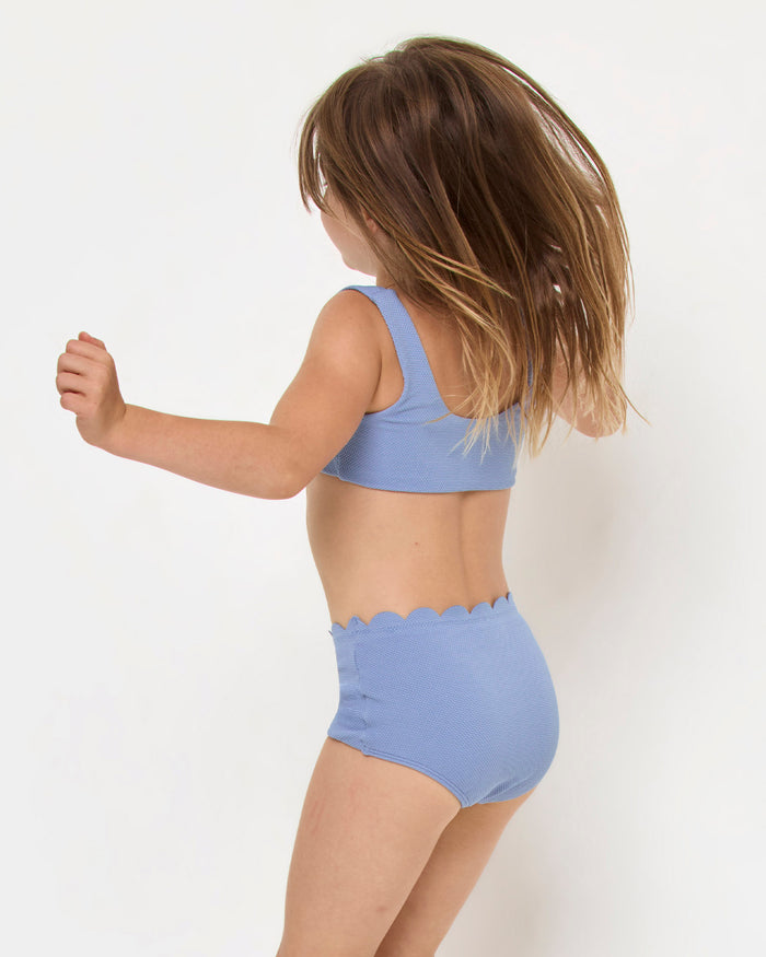 LSPACE Seashell Swirl set in chambray, back view on model.