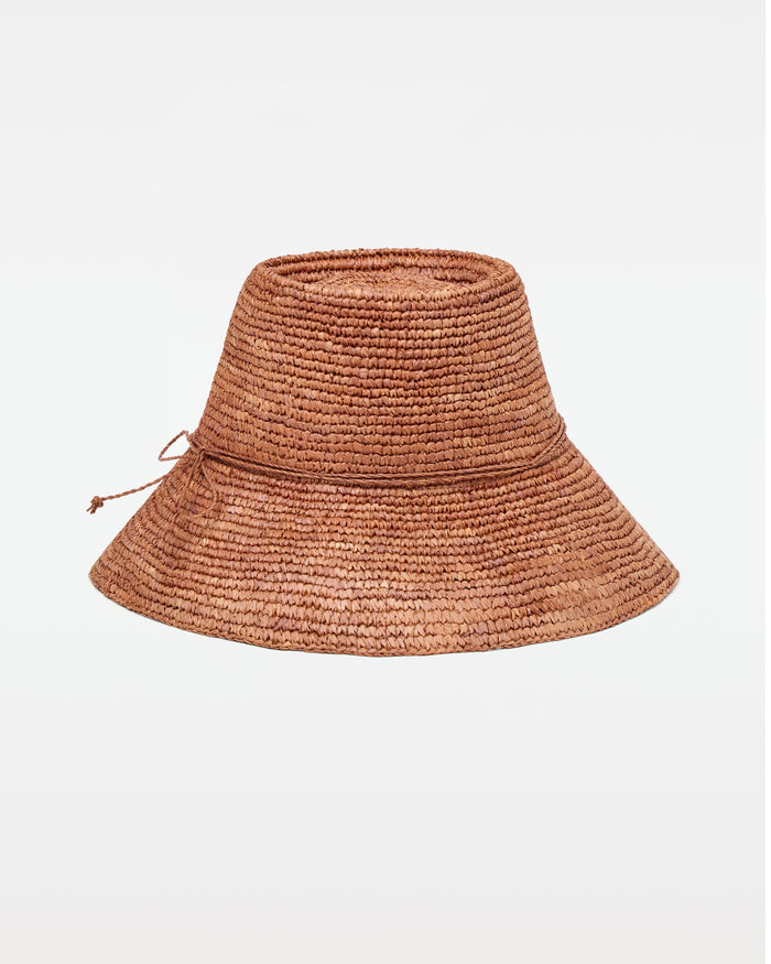 Off-model front view of the brown Seville Hat, a woven straw bucket hat with cord tie.