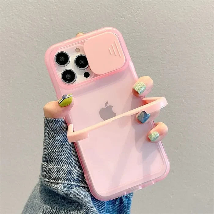 a woman holding a pink iphone case