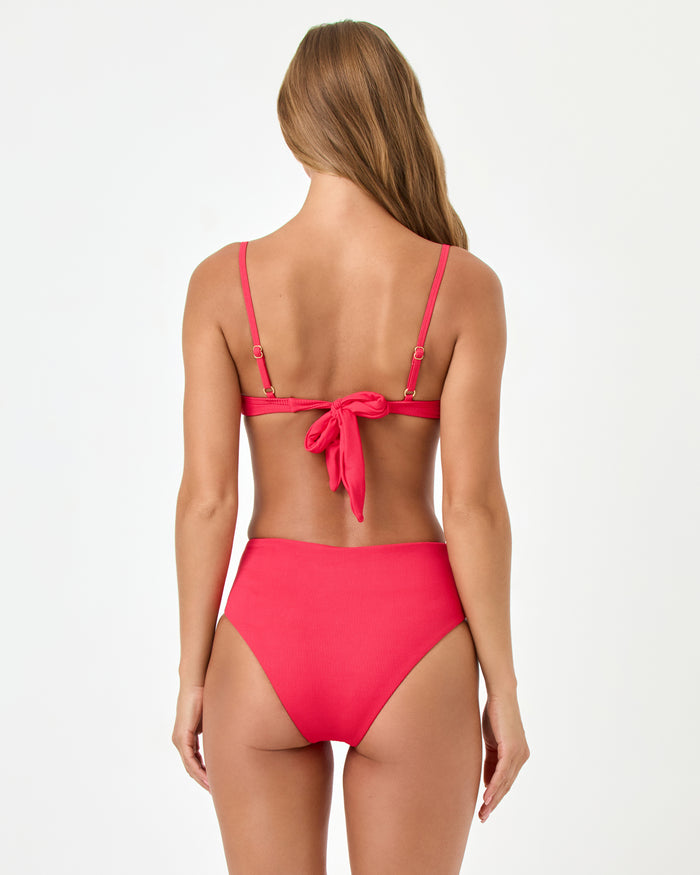 Back view of a model wearing the LSPACE pout Soleil Bikini Bottom with the Hunter Bikini Top.
