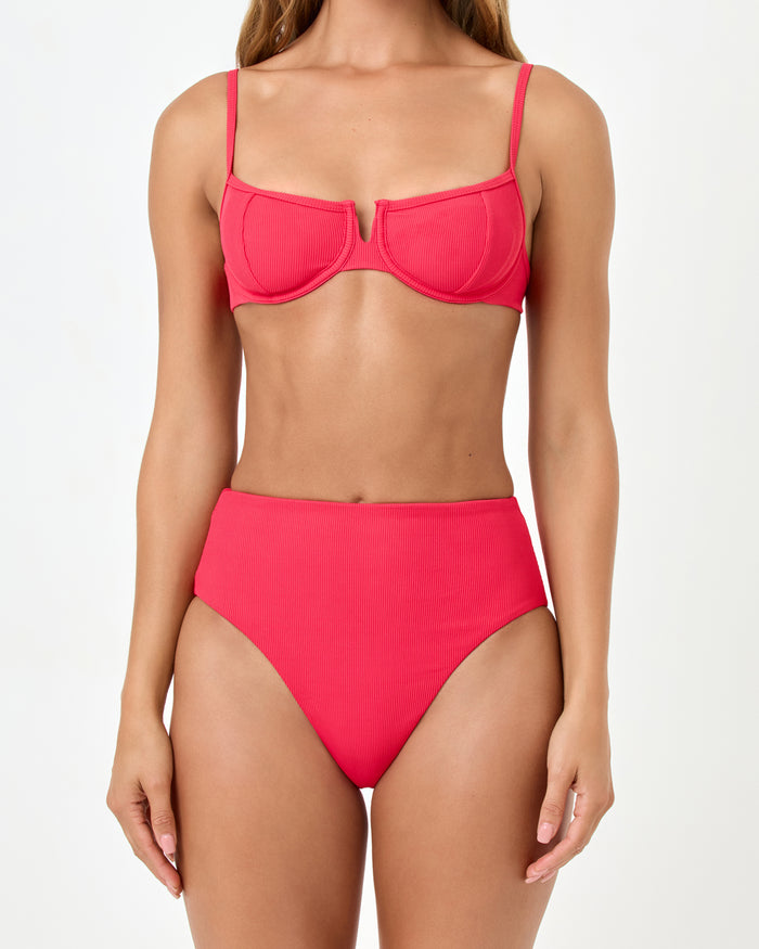 Close-up front view of a model wearing the LSPACE pout Soleil Bikini Bottom with a high-waist silhouette.