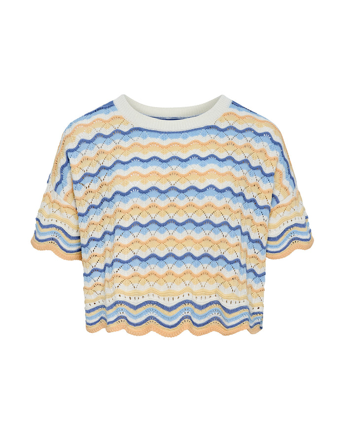 Off-model view of the LSPACE Sunchaser Top in Daydreamer, a short-sleeve crochet top in a blue, peach, and white wave pattern with crew neckline and scalloped hem.