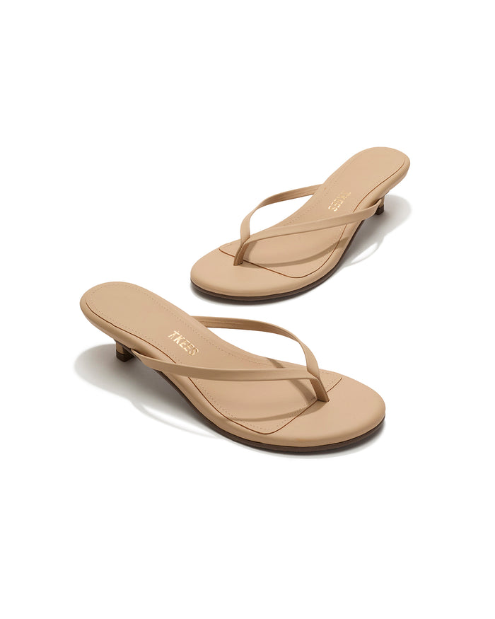 Angled view of both sunkissed nude leather TKEES Julia Kitten Heel thong sandals.