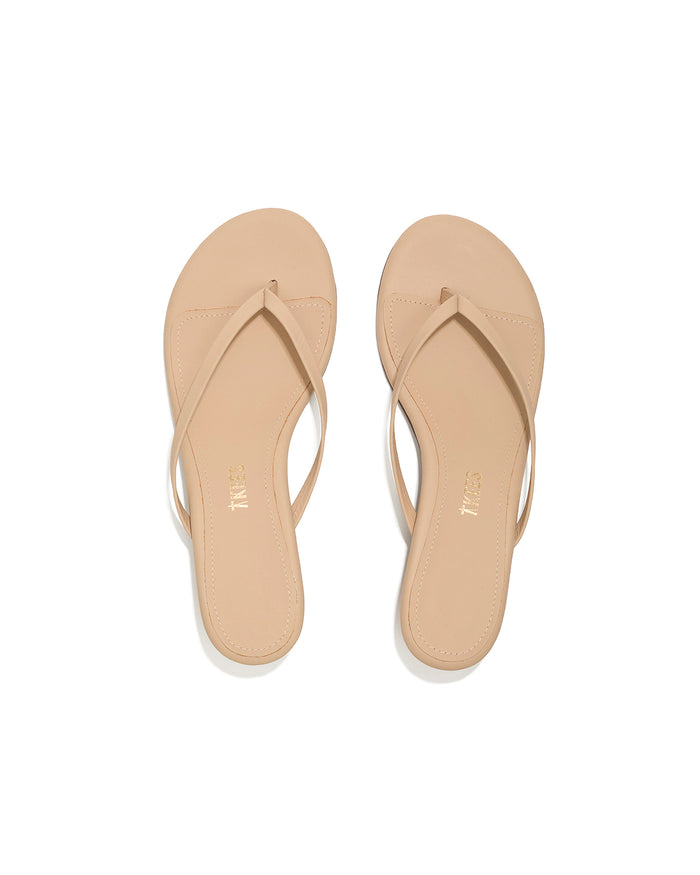 Top-down view of both sunkissed nude leather TKEES Julia Kitten Heel thong sandals.