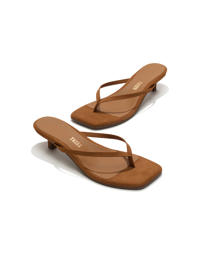 Angled view of both camel suede TKEES Square Toe Julia sandals with TKEES logo on footbed.