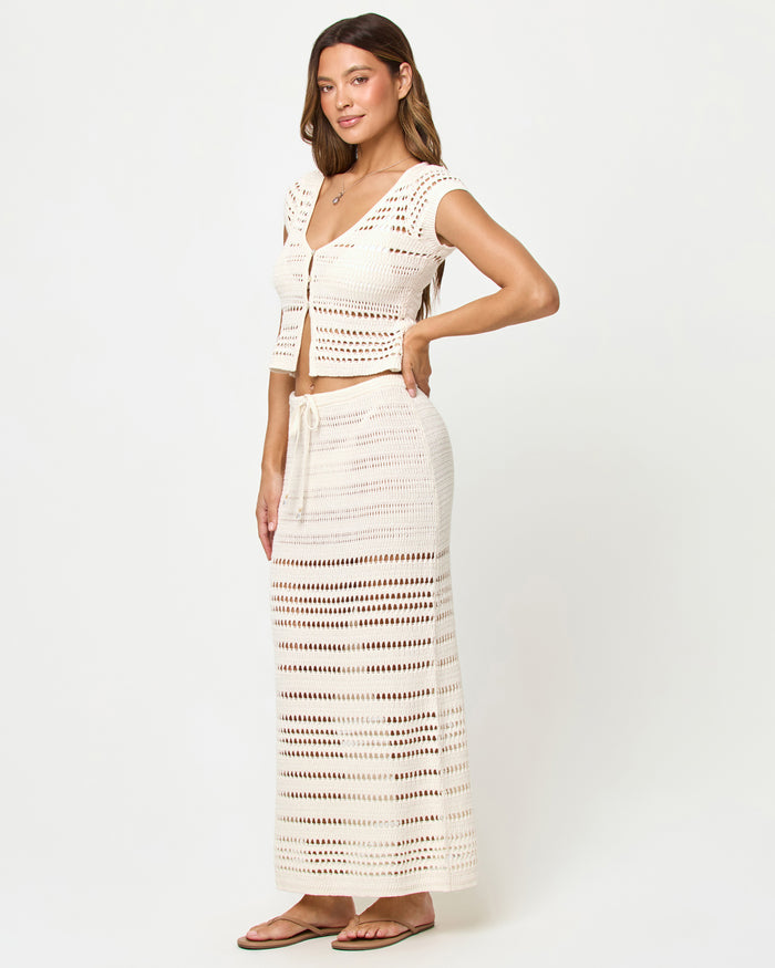 Side view of model wearing the LSPACE Tula Top and Skirt.