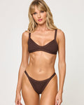 Front view of a model wearing the LSPACE espresso Tyla Bikini Top, a diamond-textured bralette in dark brown, paired with a matching espresso textured Mackenzie Bikini Bottom.