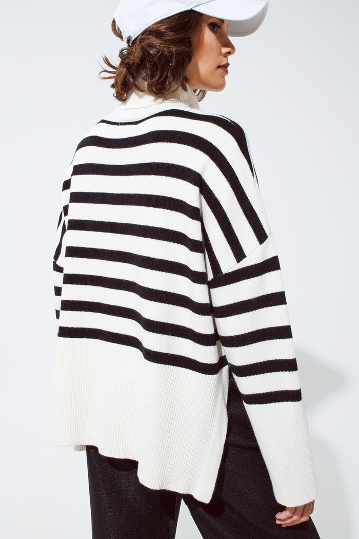 White oversized trutleneck sweater with black stripes and splits on the side